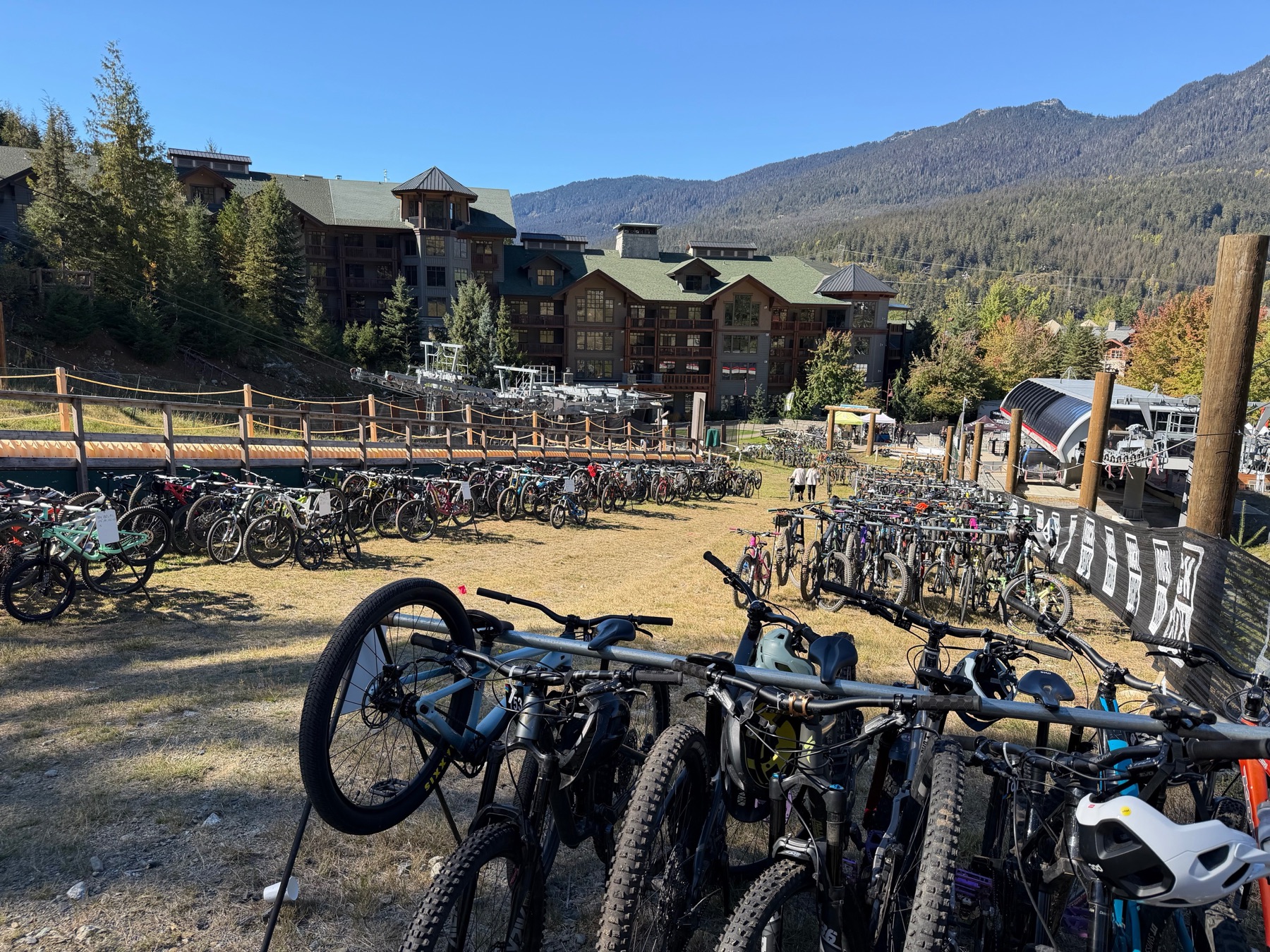 Rows of checked-in bikes beneath the mountains at Whistler.